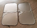 Titanium silver aluminium foil car sunshade for windshield heat and UV protection.