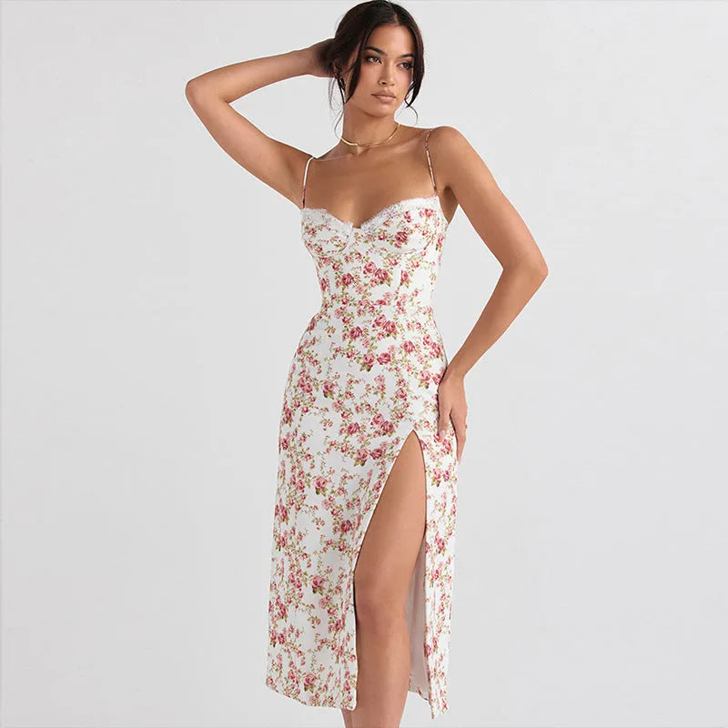 Women's long dress with lace flowers print, thigh-high slit, and suspender straps in blue.