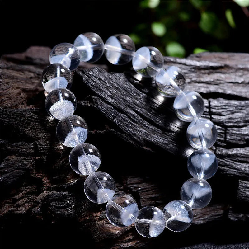 Women's white crystal pyramid bracelet with Ruyi charm in natural ghost colour showing geometric beads
