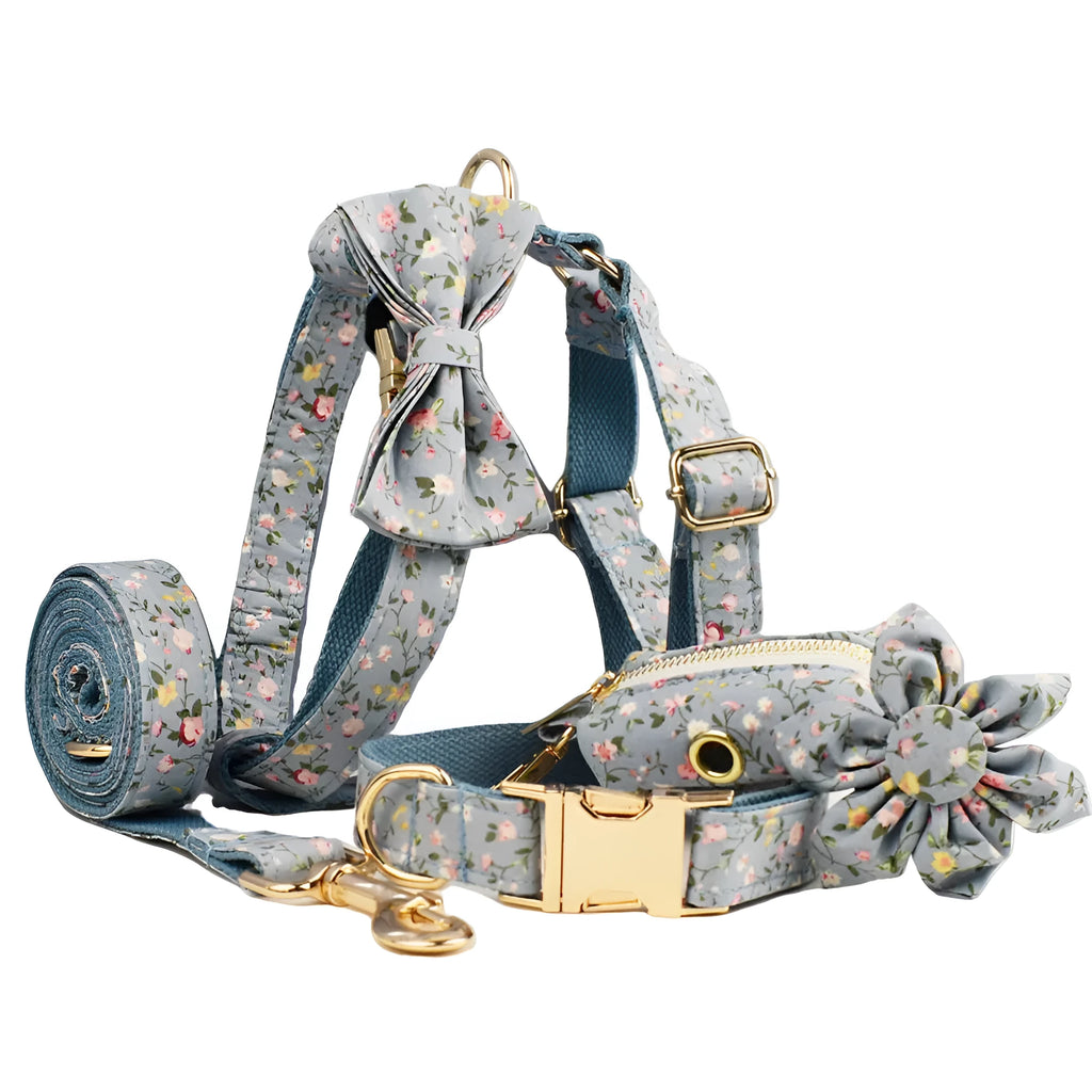 Blue floral pattern dog collar made from polyester cotton fabric with adjustable strap and decorative bow accessory.