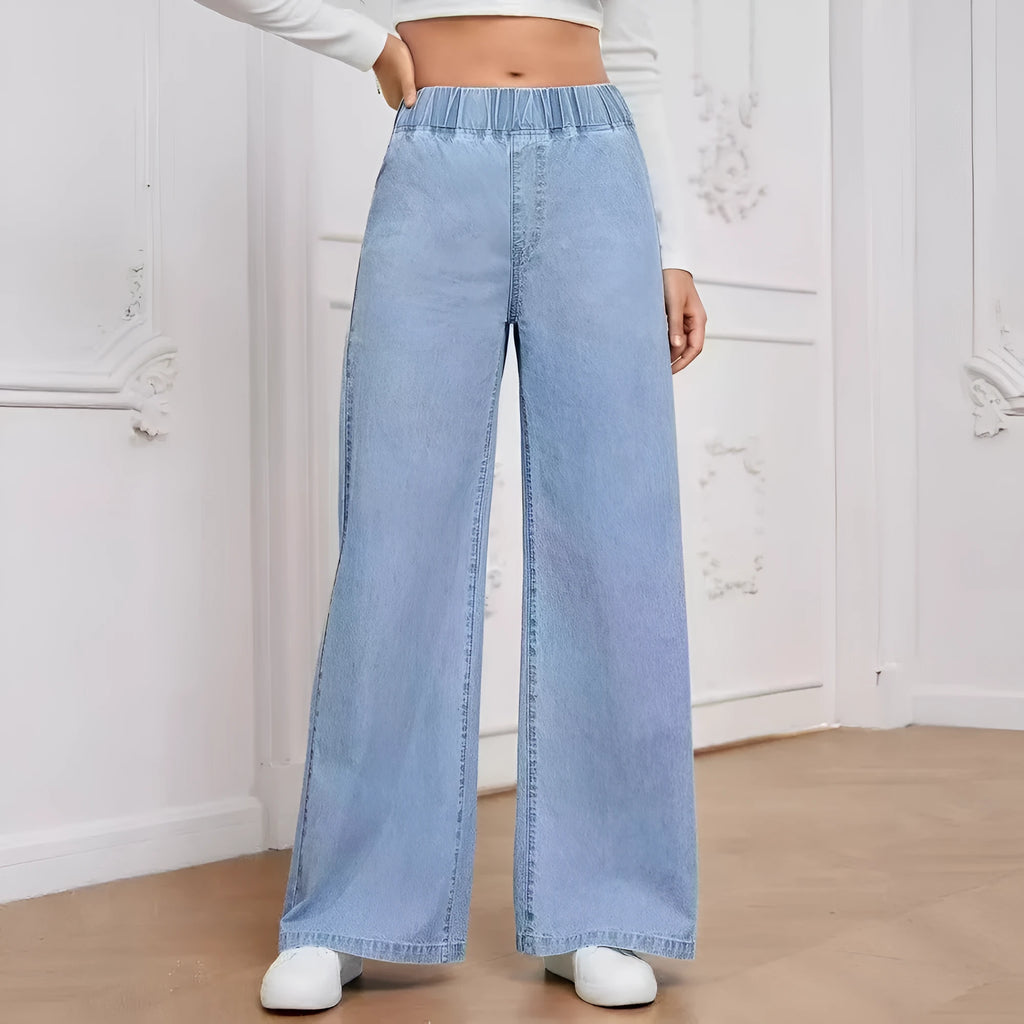 Plus size light blue washed wide-leg straight-leg jeans on a hanger.
