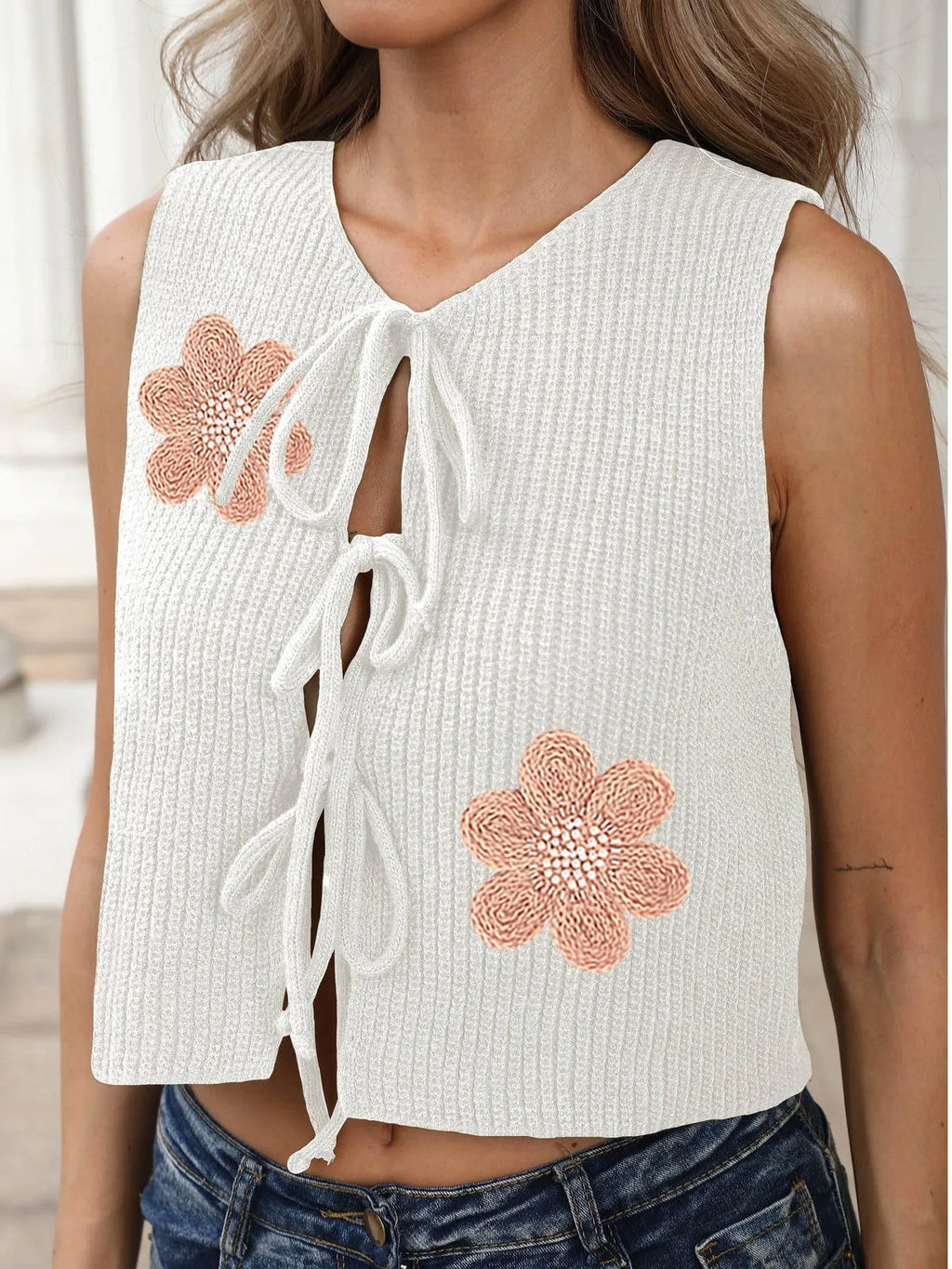 Women's white sleeveless cardigan with lace-up bow front and apricot flower pattern on deer plush fabric.