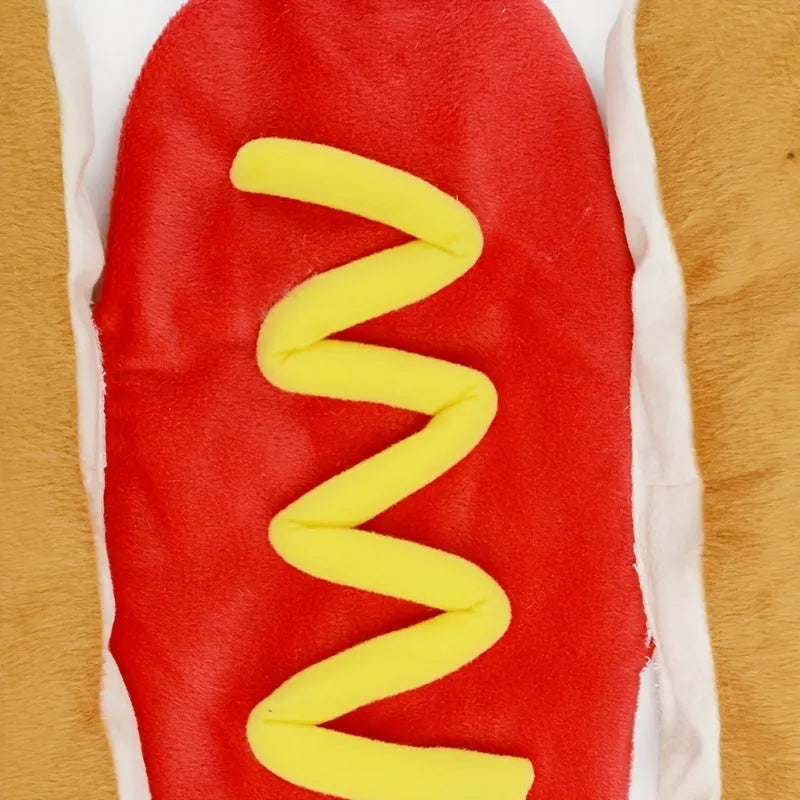 A small dog wearing a soft, stuffed hot dog costume in a winter setting.