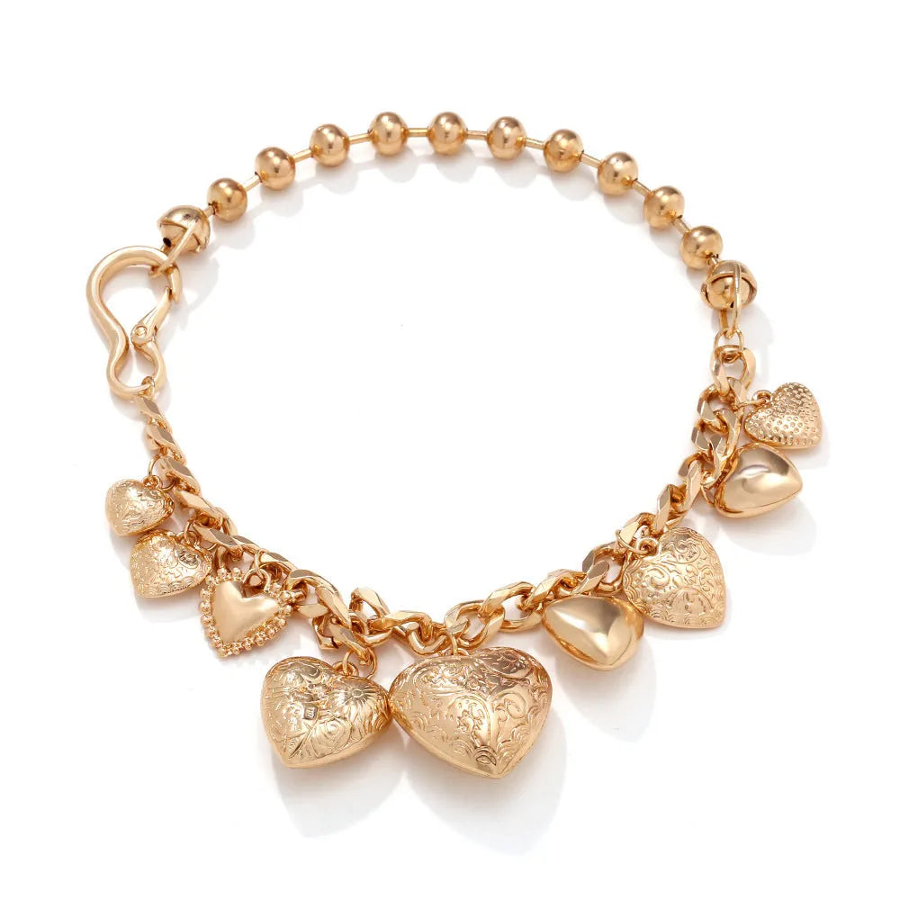 Exaggerated heart pendant necklace with dripping oil treatment in gold colour