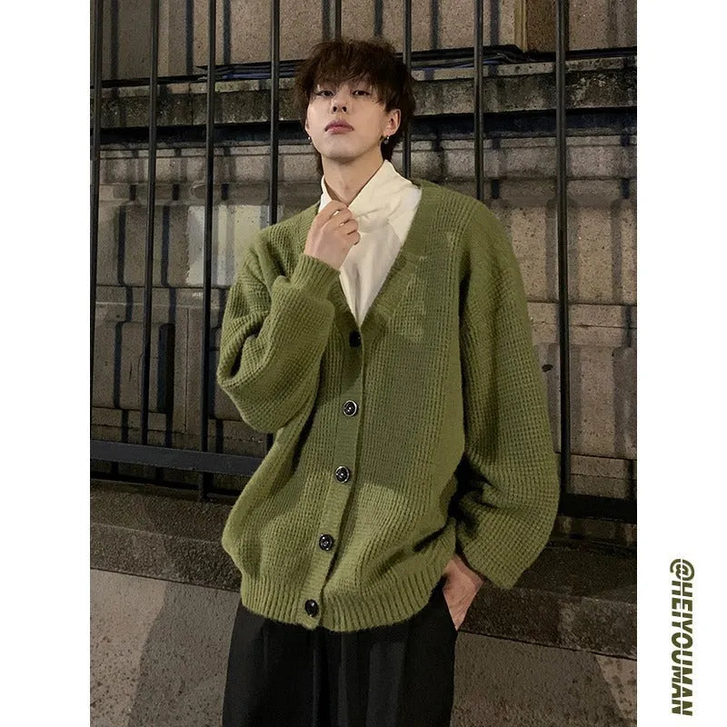 Men's loose V-neck knitted cardigan in army green, shown in a casual style