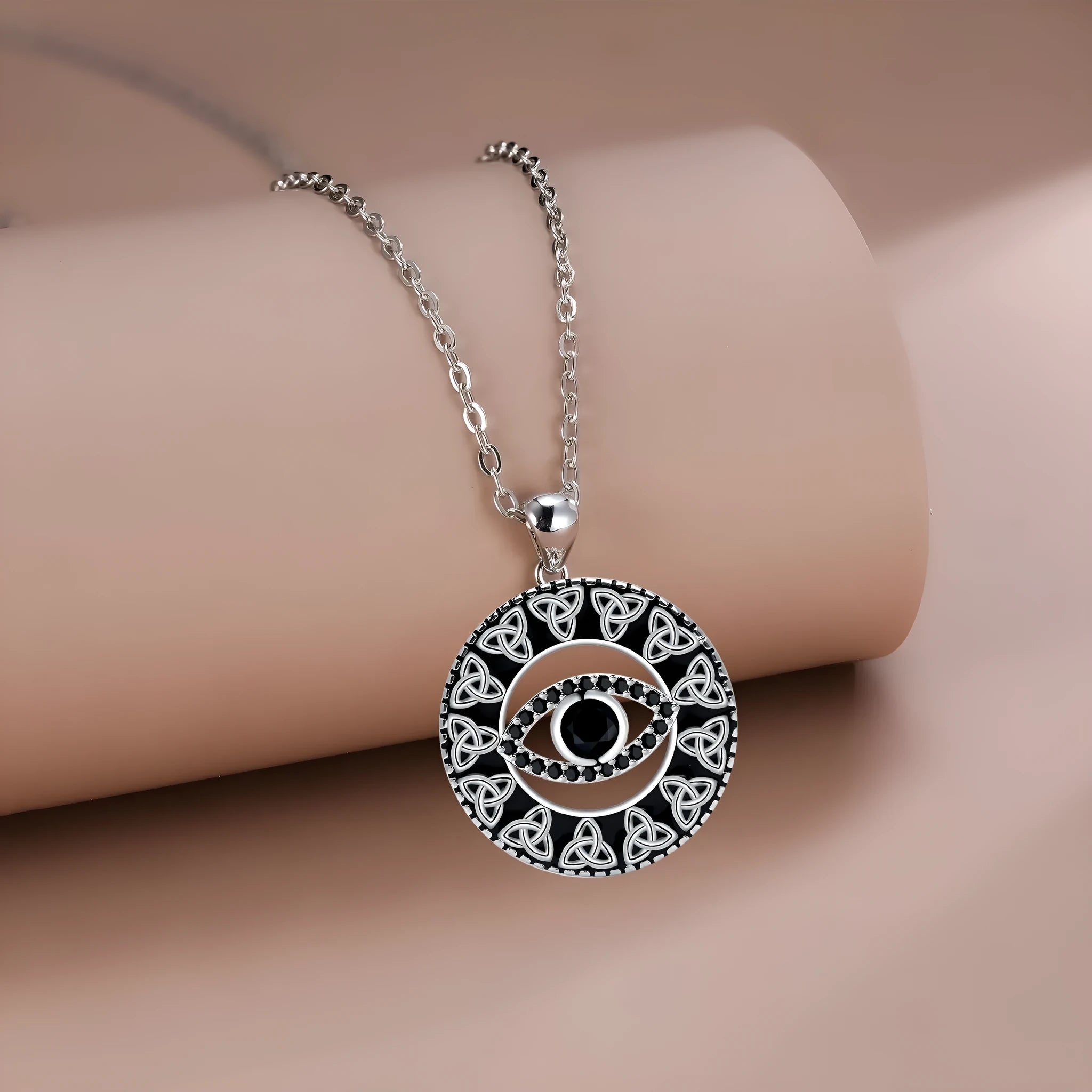 Blue Devil's Eye pendant on a copper cross chain necklace for women.