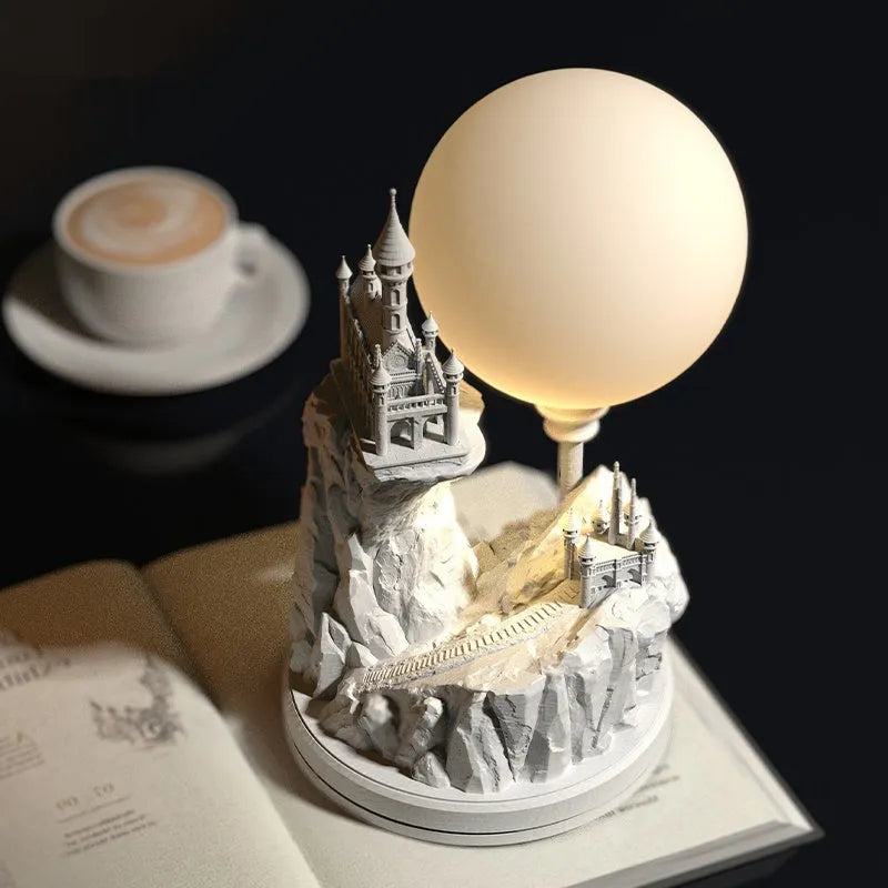White composite gypsum table lamp with cable and switch on a surface.
