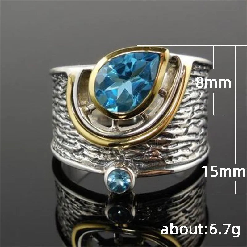 Blue Chinese style zircon ring with drop shape design and inlaid rhinestone detailing on alloy band