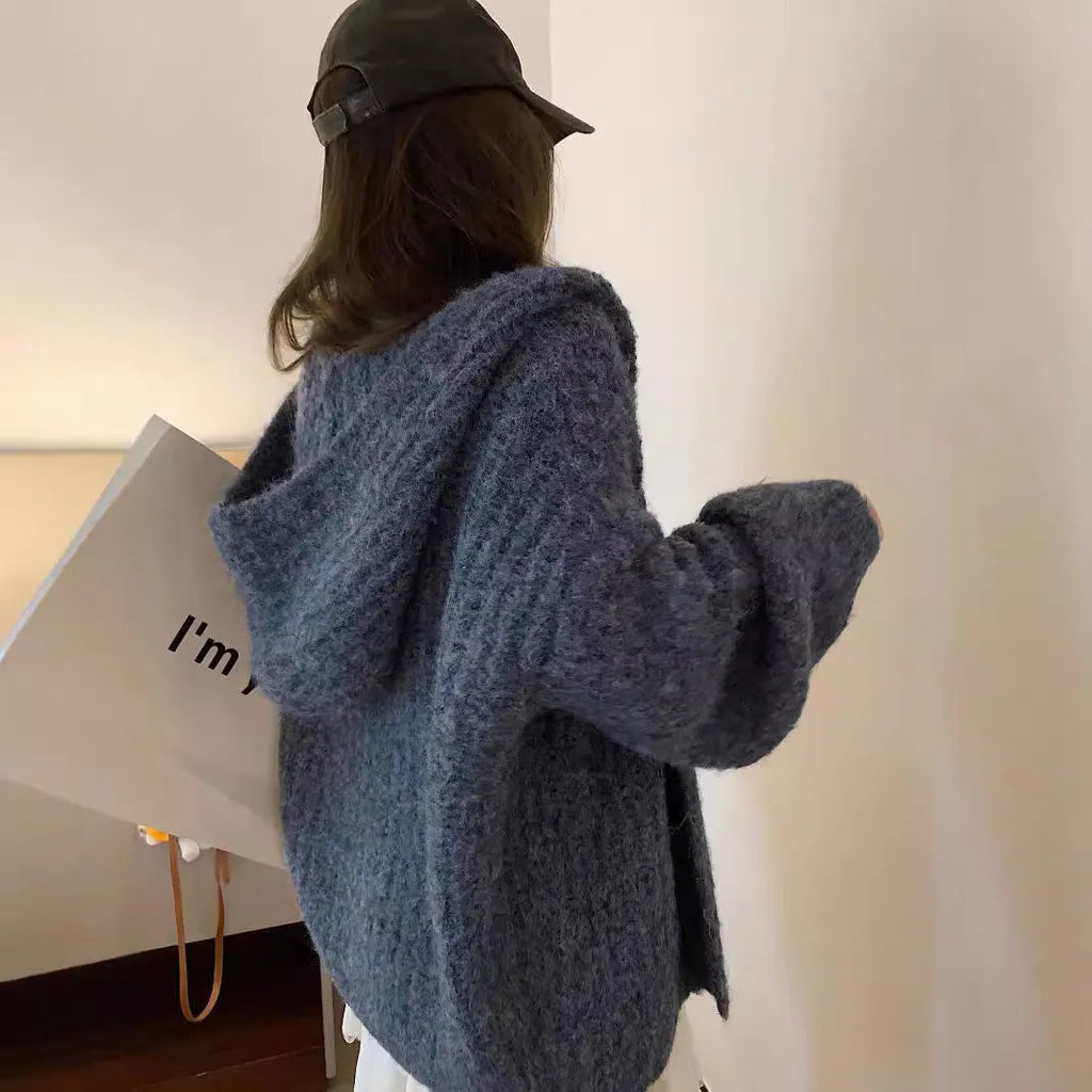 Brown loose-fit hooded cardigan sweater for women on a hanger