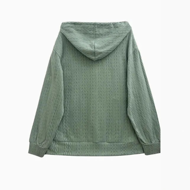 Green women's hooded zipper coat with a loose fit and long sleeves.