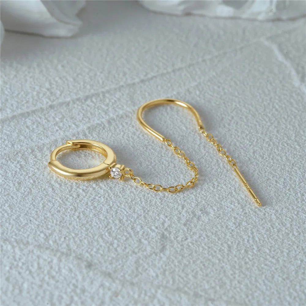 S925 sterling silver geometric ear clip stud earrings with chain, flower and tassel detail in gold electroplated finish.