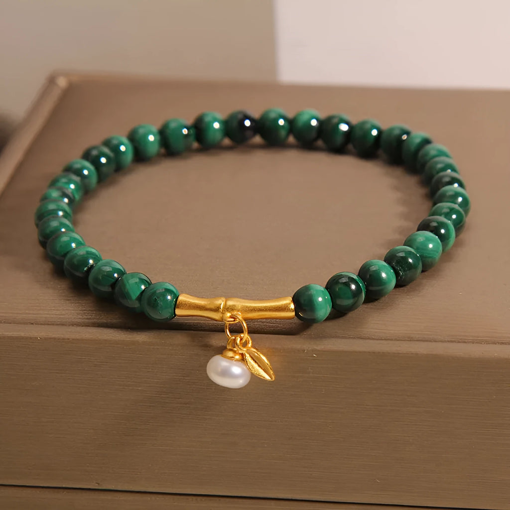 Women's adjustable white crystal bracelet with lucky bamboo charm in high-rise setting