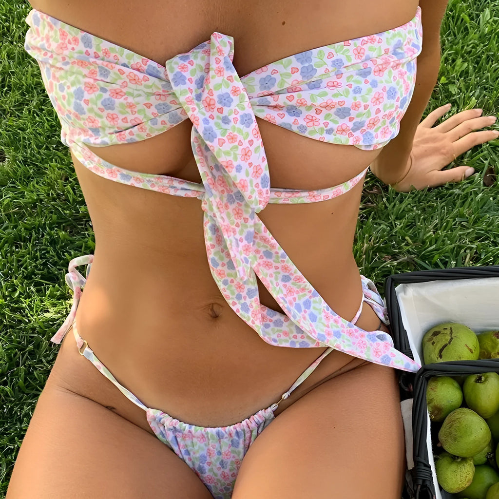 Women's lace-up swimsuit with chest pad support in a floral print.
