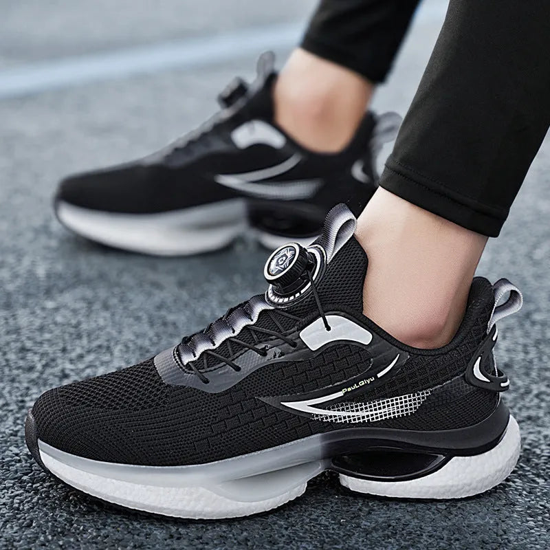 Men's white rotating buckle running shoe with Fly-knit mesh upper and low-top design.