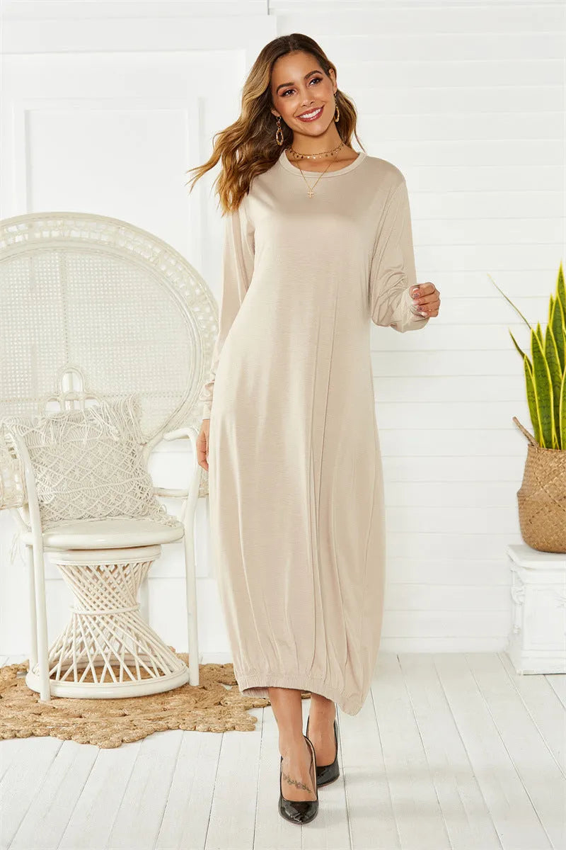 Black loose lantern dress with lace-up crew neck detail on a hanger.