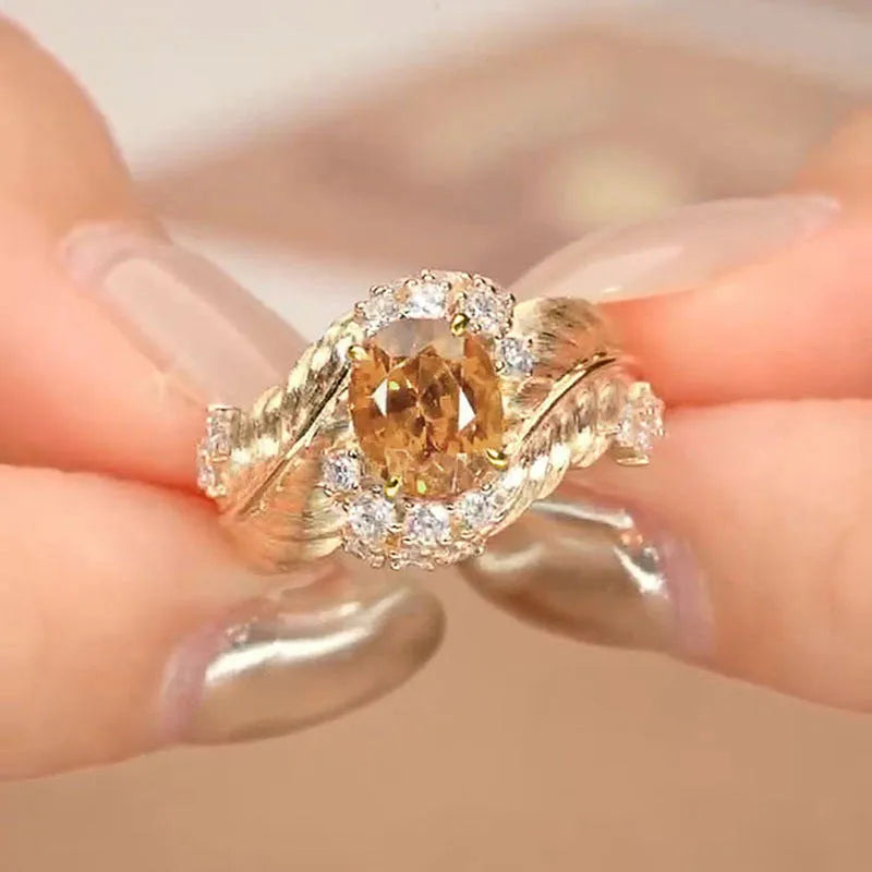 Gold colour feather embossed copper ring with yellow zircon stones in geometric design