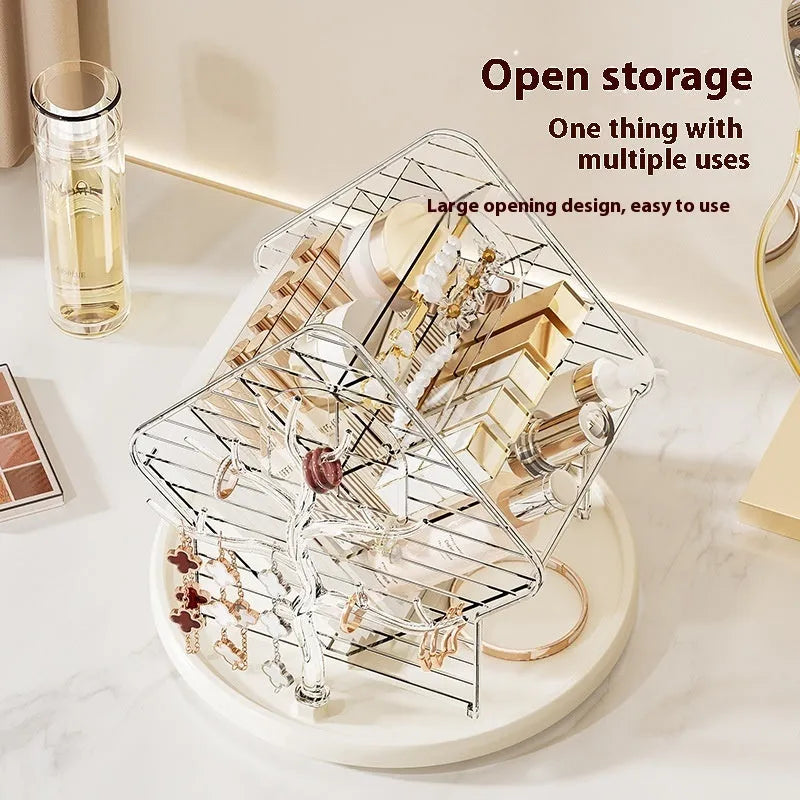 Rotating clear plastic cosmetic storage box organiser on a table.