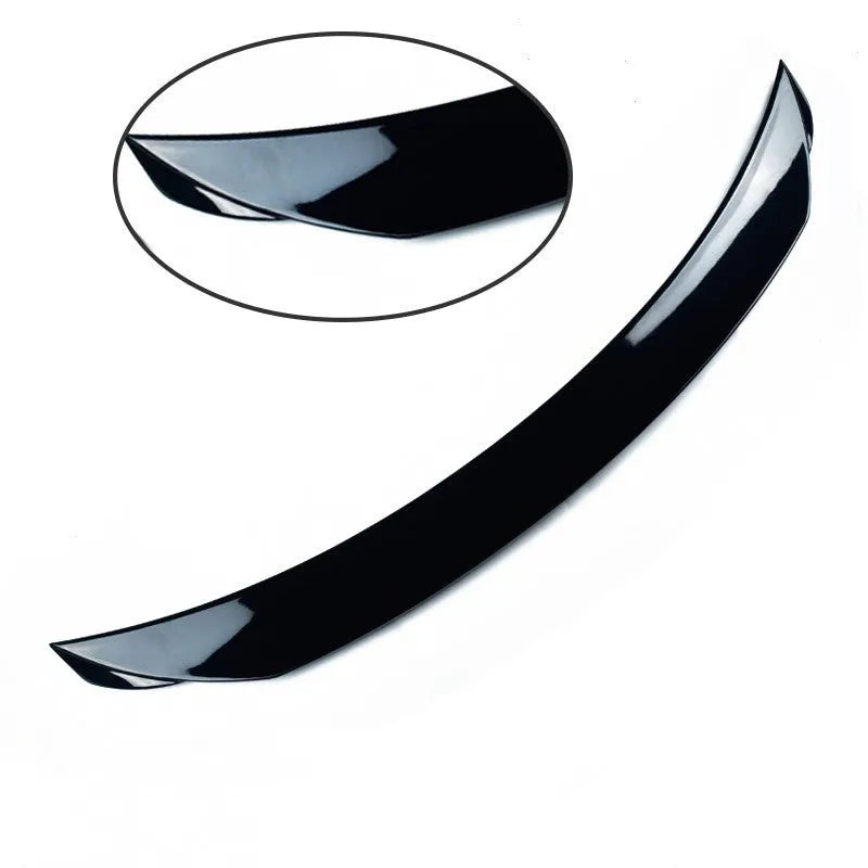 Bright black tail trim for Mazda 3 Exela 2014-2021 models showing large fixed wind-surrounded design