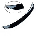 Bright black tail trim for Mazda 3 Exela 2014-2021 models showing large fixed wind-surrounded design