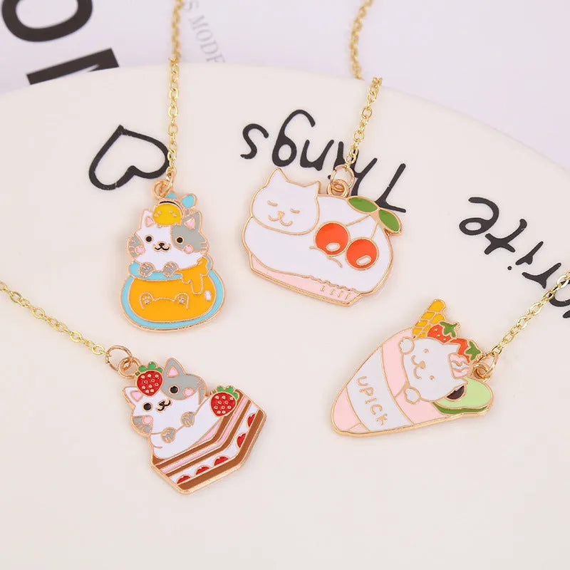 Jane Lime Foodie Cat metal bookmark with cartoon pendant in four colour variations on a white background.