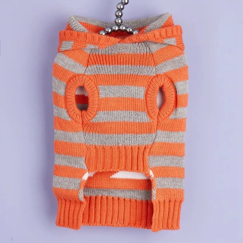 Orange striped hooded pet sweater with fur ball trim on a mannequin, sizes XS to L.