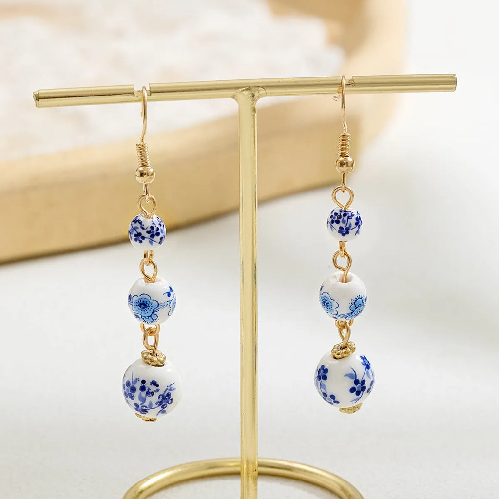 Long blue and white porcelain ceramic bead retro earrings with geometric Chinese style design on alloy.