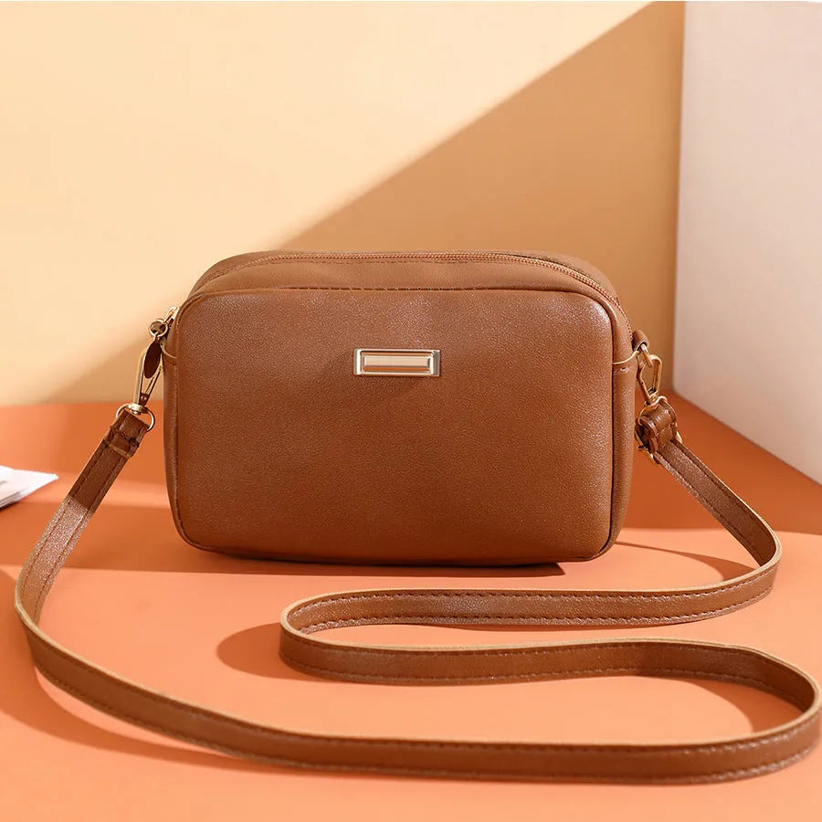 Women's solid colour PU shoulder bag with three-dimensional pocket in horizontal square design